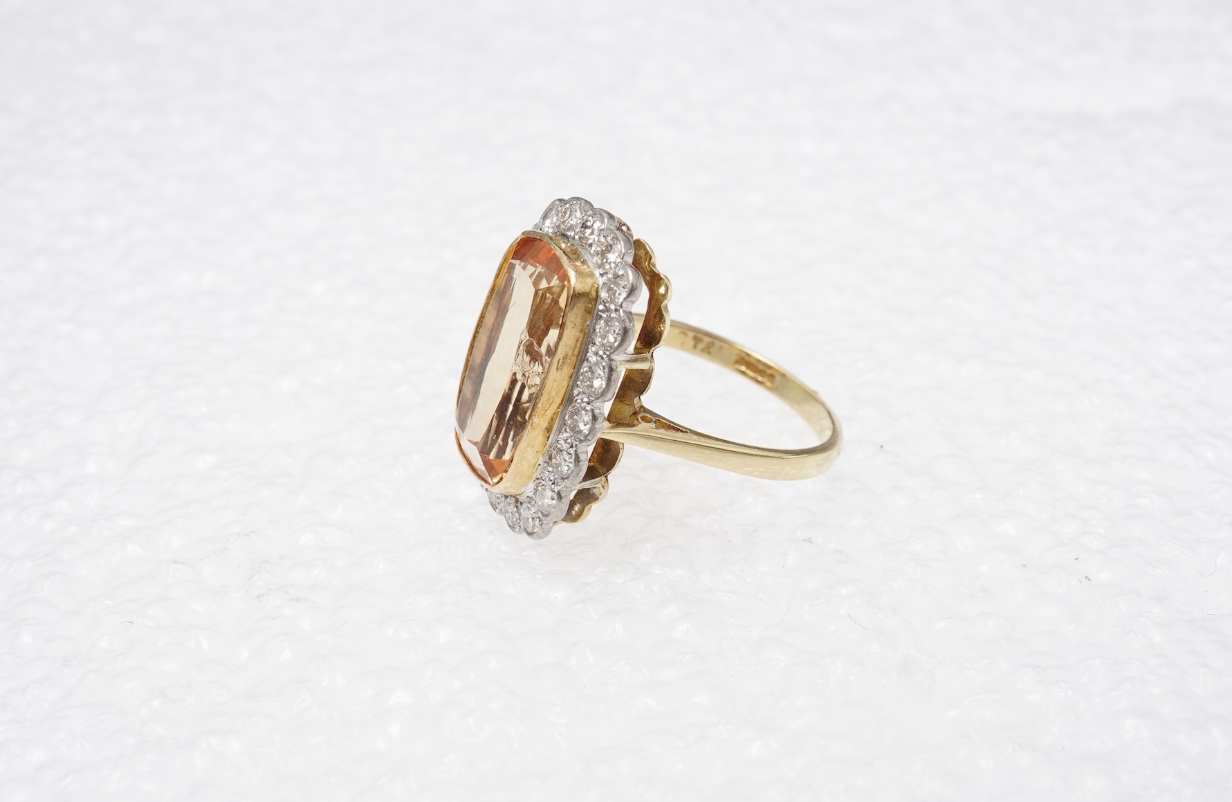 A topaz and diamond cluster ring
